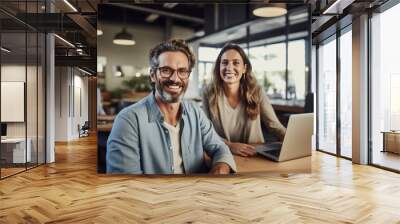 Portrait of successful business people with laptop discuss business issues in the office during meeting Wall mural