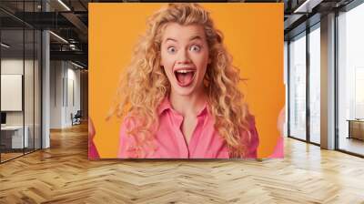 The excited blonde woman. Wall mural