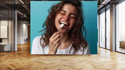 Woman Enjoying a Sweet Treat Wall mural