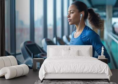 woman running on a treadmill in a gym setting, likely reflecting an active, healthy lifestyle. Wall mural