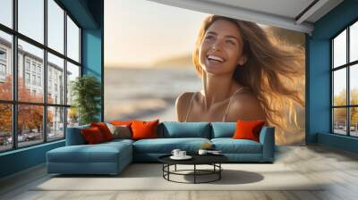 Young woman smiles happily while on vacation with the beach in the background Wall mural