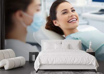 Young woman with a radiant smile is sitting in a dental chair Wall mural