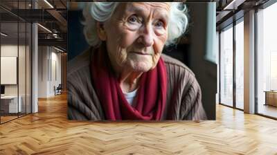 An elderly woman sitting alone, showing signs of loneliness associated with dementia. The scene conveys a deep sense of isolation and vulnerability, reflecting the emotional impact of cognitive Wall mural