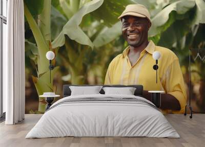 Smiling African-American man farmer with a digital tablet in a banana plantation. Concept of agricultural business technology, modern farming technology, new agriculture practices, smart farming Wall mural