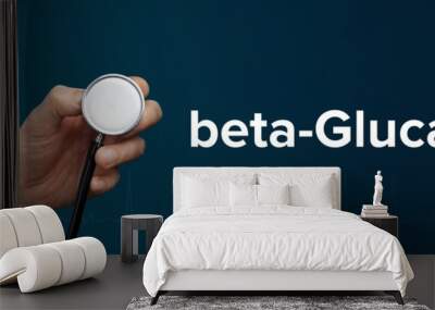 beta-Glucans. Doctor in smock holds stethoscope. The term beta-Glucans is next to it. Symbol of medicine, illness, health Wall mural