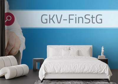 GKV-FinStG (GKV-Finanzstabilisierungsgesetz). Arzt zeigt mit Finger auf Suchfeld im Internet. Text steht in der Suche. Blauer Hintergrund. Medizin, Gesundheitswesen Wall mural