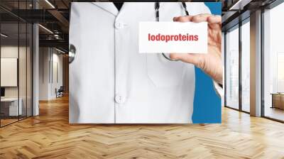 Iodoproteins. Doctor in smock holds up business card. The term Iodoproteins is in the sign. Symbol of disease, health, medicine Wall mural