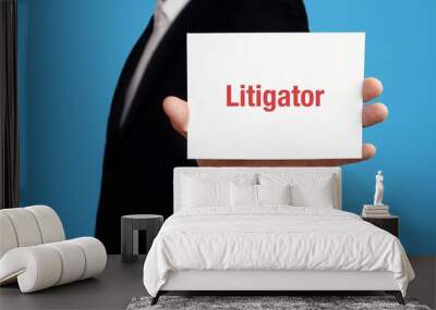 Litigator. Business man in a suit holds card at camera. The term Litigator is in the sign. Symbol for business, finance, statistics, analysis, economy Wall mural