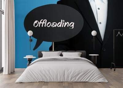 Offloading. Businessman in suit holds speech bubble at camera. The term Offloading is in the sign. Symbol for business, finance, statistics, analysis, economy Wall mural