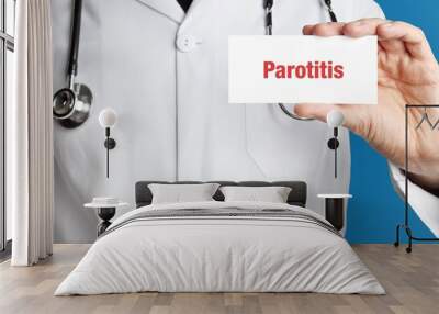 Parotitis. Doctor in smock holds up business card. The term Parotitis is in the sign. Symbol of disease, health, medicine Wall mural