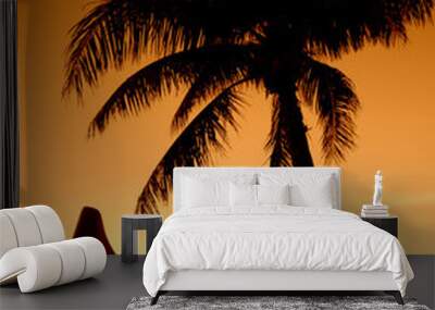 A Palm Tree And Outrigger Canoe Set Against A Hawaiian Sunset Wall mural