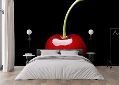 126. A single ripe cherry isolated on a pristine black background Wall mural