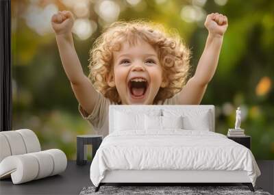 30. A child expressing joy with a wide-open mouth and raised arms Wall mural