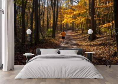 51. A scenic running trail through a picturesque forest with a runner in motion Wall mural