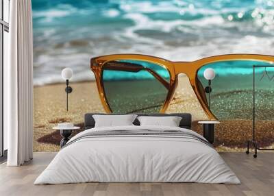 58. A trendy pair of sunglasses on a sandy beach Wall mural