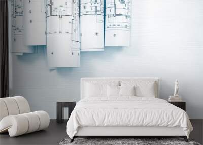 architectural blueprints and blueprint rolls on white wooden desk Wall mural