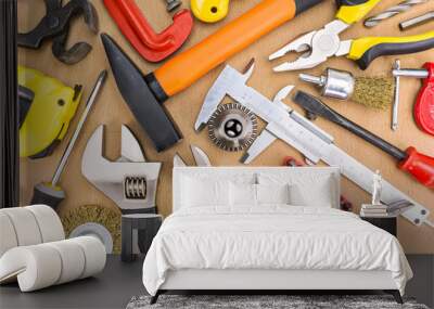 Different tools on a wooden background Wall mural