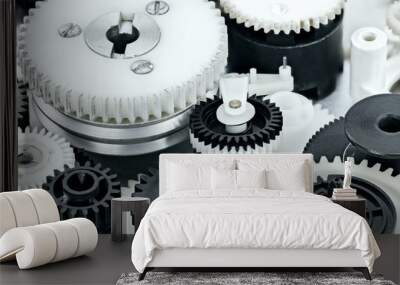 parts of industrial mechanisms. plastic black and white cogwheels. Wall mural