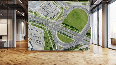 road intersection with roundabout in the city. cars traffic at sunny summer day. aerial top view. Wall mural