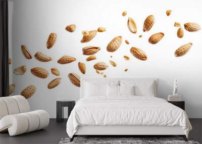 Falling peanuts isolated on a white background with a close-up view. Flying nuts texture for design and packaging Wall mural