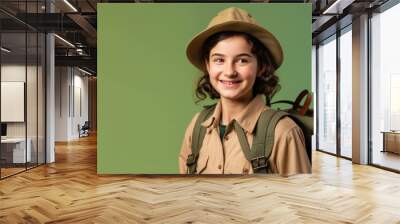 Exploring the Outdoors: Smiling scout with backpack 
 isolated on olive green background with space for text. Camping concept - AI Generative Wall mural