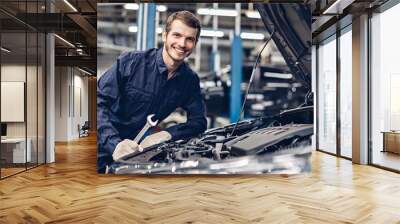 Auto car repair service center. Mechanic examining car engine Wall mural