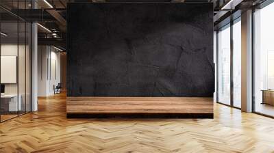 Wooden table or counter top with black stone wall background Wall mural