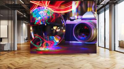 Blurred closeup of digital camera reflecting an illuminated colorful lighting with Len ball. Wall mural