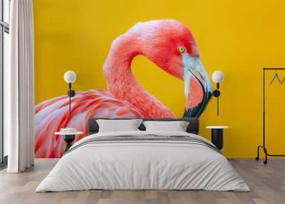 Vibrant pink flamingo against a bright yellow backdrop Wall mural