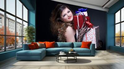 closeup portrait of girl with red lips, tinsel and present on bl Wall mural