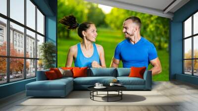 Runners training outdoors working out. City running couple Wall mural