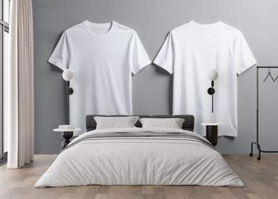 two white t - shirts hanging on a wall stock photo Wall mural