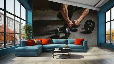 Tying sports shoe. Wall mural