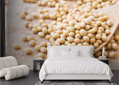 Closeup soy beans on wood spoon with sackcloth background , healthy food concept Wall mural