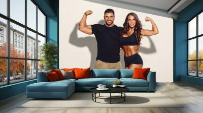 Fitness Couple Posing Together. Studio Shot Wall mural