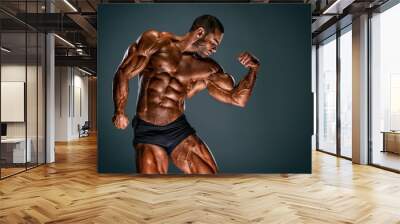 Handsome Muscular Bodybuilder Flexing Muscles Wall mural