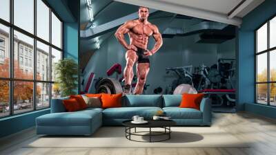 Muscular Man at the |Gym preparing to lift heavy weights Wall mural