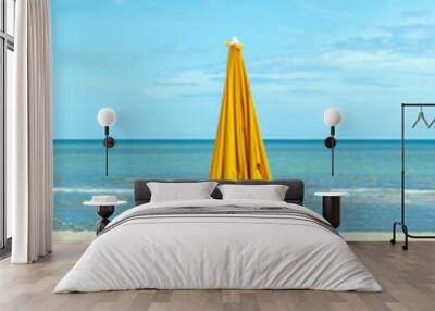 Two beach chairs with sun umbrella on beautiful beach. Wall mural