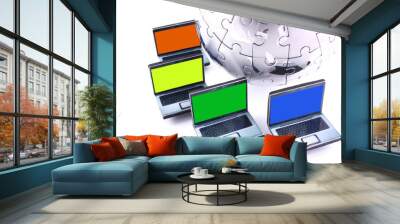 Laptops with one colour screens around a chrome jigsaw globe Wall mural