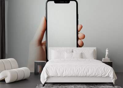 hand holding smartphone mockup with white background Wall mural