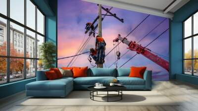 Electrician lineman with cranes and hoists repairman worker at climbing work on electric post power pole Wall mural