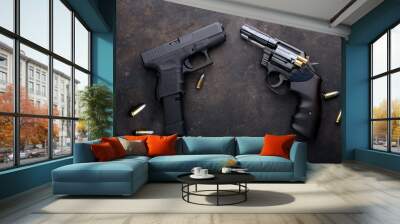 Gun with ammunition on iron dark background. Wall mural