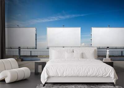 three large blank billboards under a clear sky Wall mural