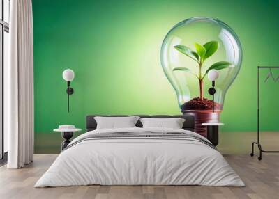 A light bulb with a plant sprout inside green energy background for copy space Wall mural