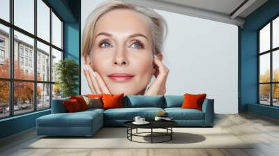 Close up portrait of a gorgeous, beautiful  mid aged, 50s mature woman touching her smooth healthy skin. Anti aging, skin care, cosmetic, spa, bodycare, wrinkles treatment concept with copy space for Wall mural