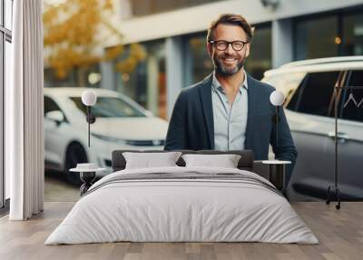 Mature businessman using digital tablet. Car salesperson working at the dealership using a tablet Wall mural