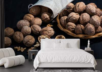 Walnuts on a wooden black table Wall mural