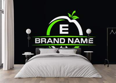 sports nutrition logo template with letter e. green apple with dumbbell vector design. fitness nutri Wall mural