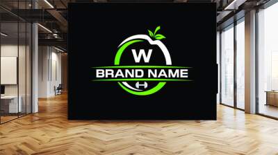 sports nutrition logo template with letter w. green apple with dumbbell vector design. fitness nutri Wall mural