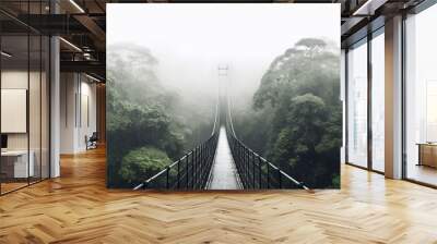 Perspective view of empty suspension bridge with green trees growing in misty and rainy forest in costa rica Wall mural